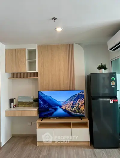 Modern living room with sleek TV setup and stylish storage solutions