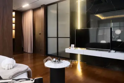 Luxurious modern living room with sleek TV setup and elegant decor