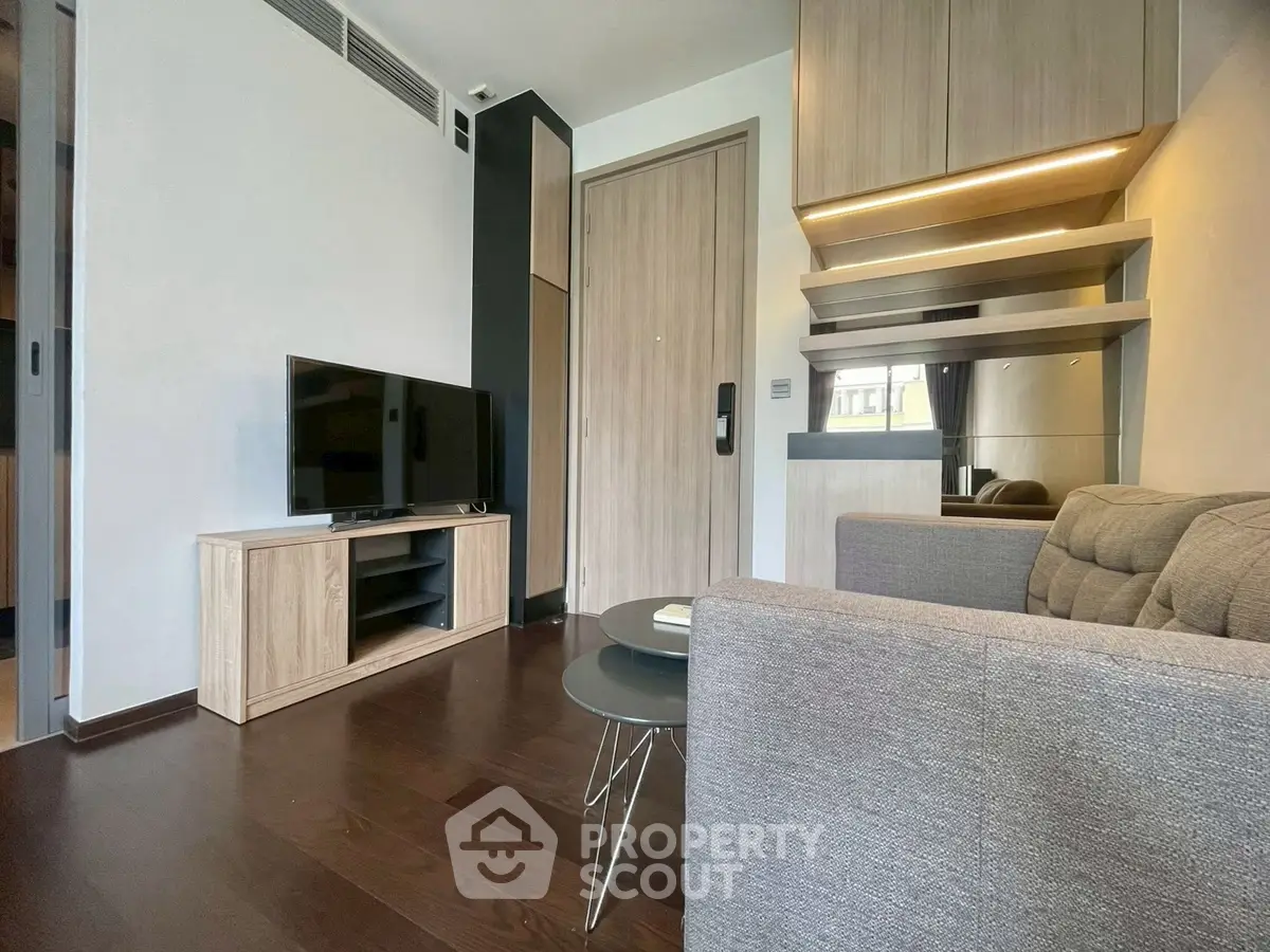 Modern living room with sleek furniture and wooden flooring