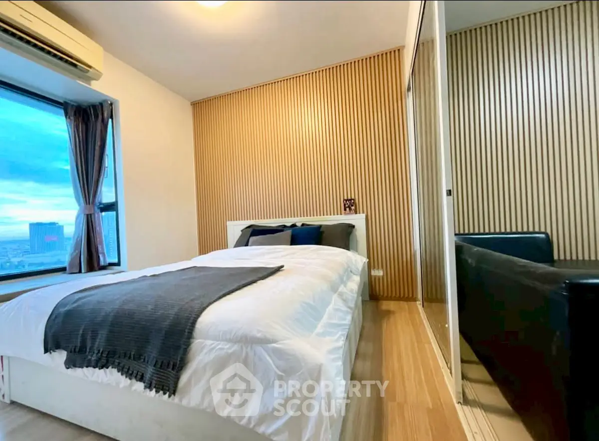 Modern bedroom with wooden accent wall and city view window