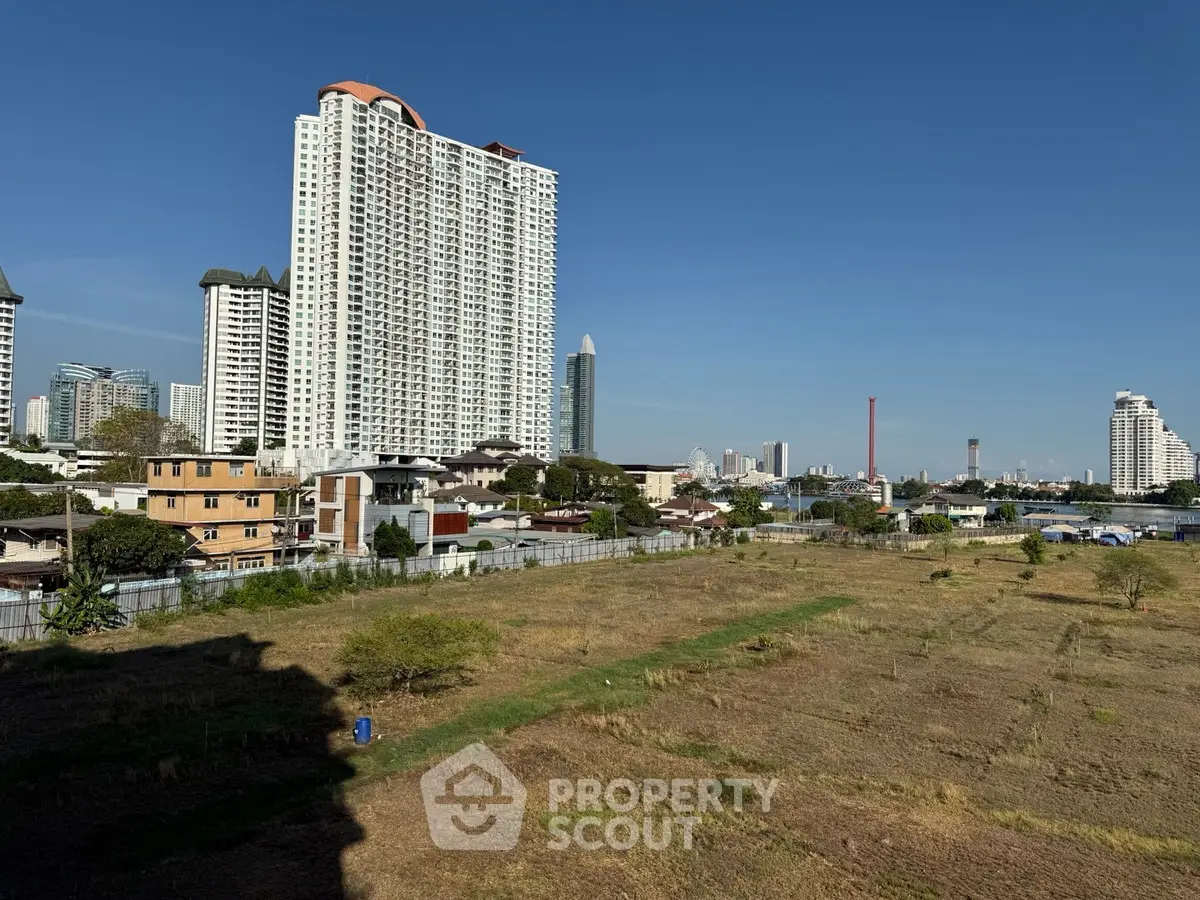 Stunning cityscape view with high-rise buildings and open land, perfect for development opportunities.