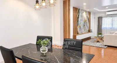 Modern living room with elegant dining area and stylish decor