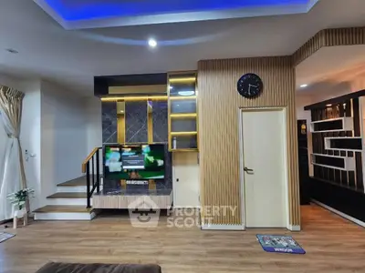 Modern living room with stylish wooden accents and built-in TV unit