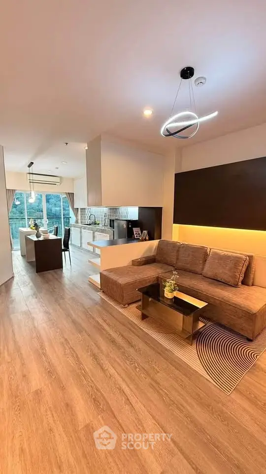 Spacious modern living room with open kitchen and stylish decor