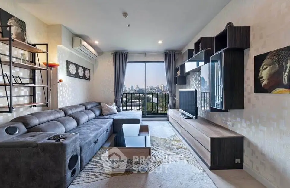 Stylish living room with modern decor and city view balcony, featuring a plush sectional sofa and sleek entertainment unit.