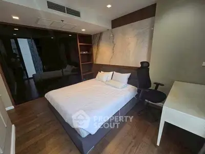 Modern bedroom with elegant decor and wooden flooring