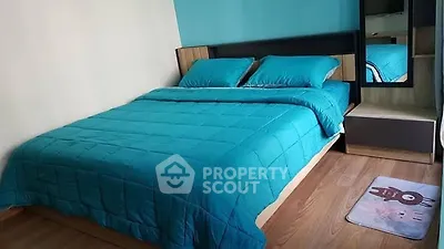 Cozy bedroom with teal bedding and modern decor