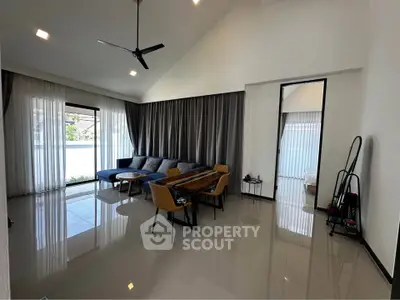 Spacious modern living room with high ceiling and elegant decor