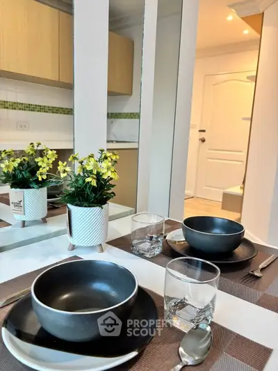 Modern kitchen with elegant dining setup and stylish decor