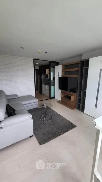 Modern living room with sleek furniture and open layout in a stylish apartment.