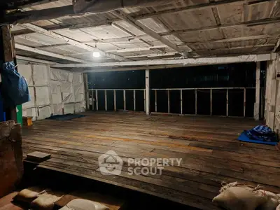Spacious rustic wooden deck with ambient lighting, perfect for outdoor gatherings and relaxation.