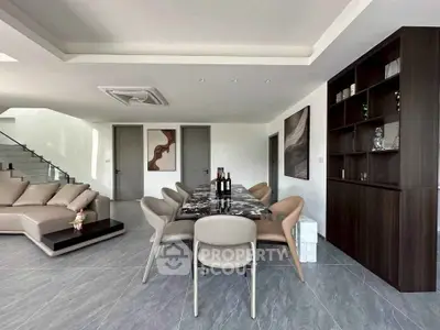 Spacious modern living room with elegant dining area and stylish decor