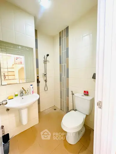 Modern bathroom with sleek fixtures and stylish tile design, perfect for a contemporary home.
