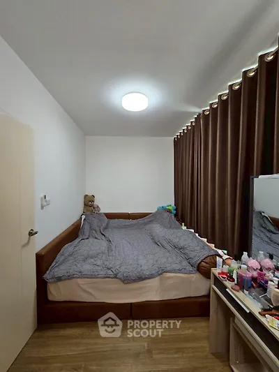 Cozy bedroom with modern decor and ample natural light