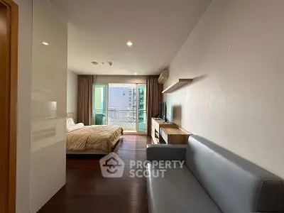 Modern bedroom with balcony and stylish furnishings in a cozy apartment
