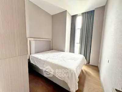 Cozy minimalist bedroom with natural light and modern decor