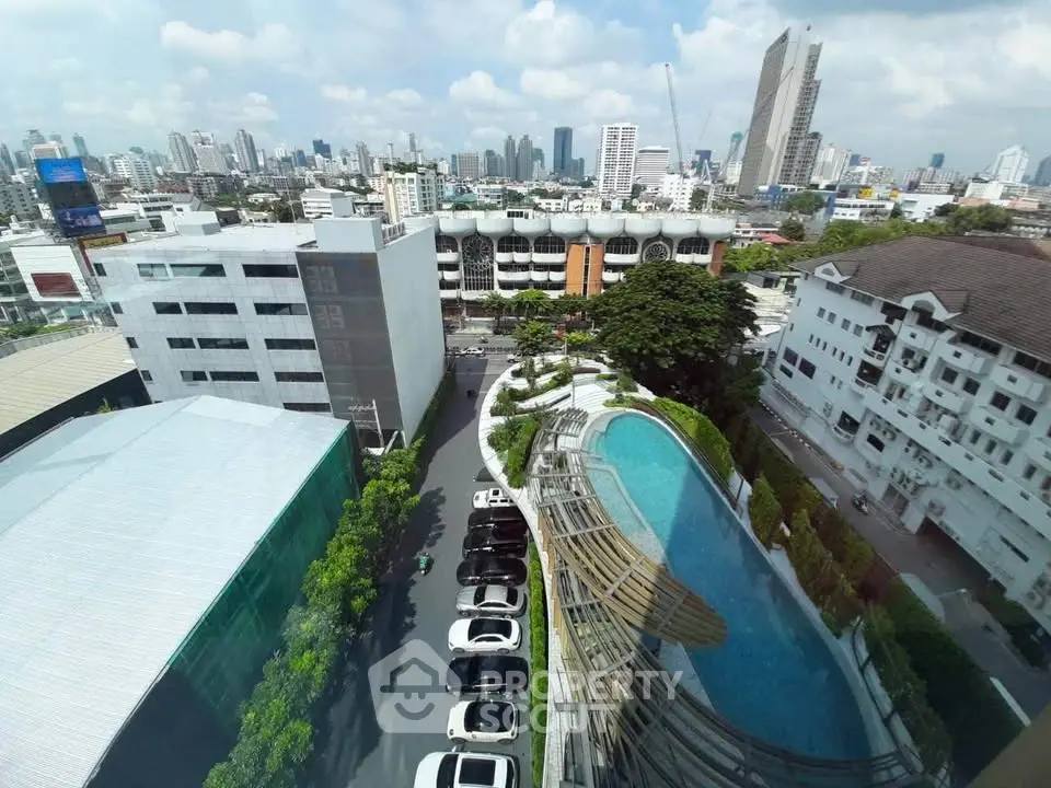 Stunning cityscape view with modern buildings and a sleek pool, perfect for urban living.