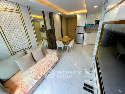 Modern living room with elegant decor and open kitchen layout