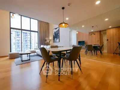 Spacious modern living room with elegant dining area and large windows