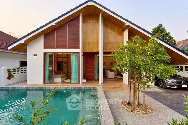 Stunning modern house with pool and lush greenery, perfect for luxury living.