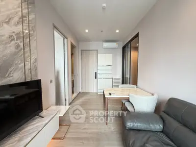 Modern living room with sleek furniture and open layout in a stylish apartment.