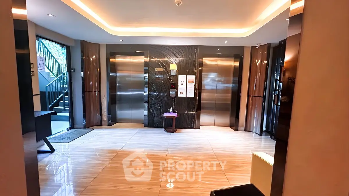 Luxurious modern elevator lobby with elegant lighting and marble flooring