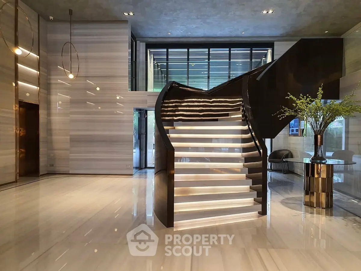 Luxurious modern building lobby with elegant staircase and sleek design