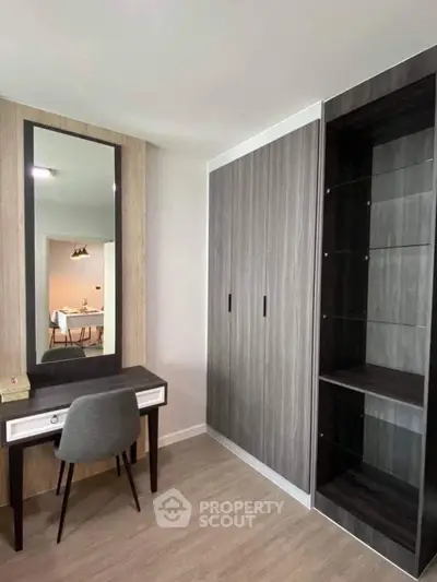 Modern bedroom with stylish vanity and sleek wardrobe design