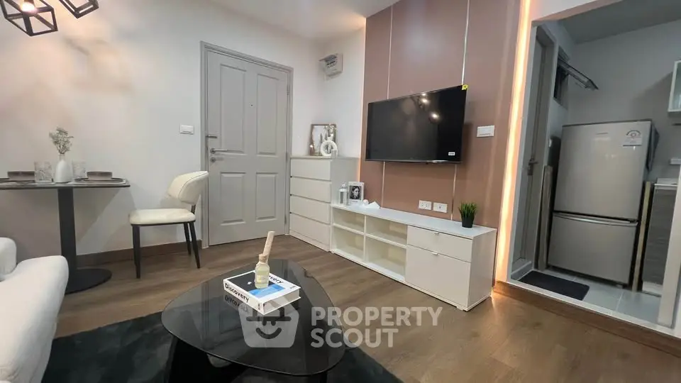 Modern living room with sleek furniture and wall-mounted TV
