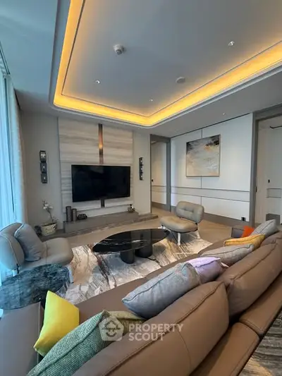 Luxurious modern living room with stylish furniture and ambient lighting, perfect for relaxation and entertainment.