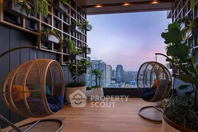 Stunning balcony with hanging chairs and city skyline view