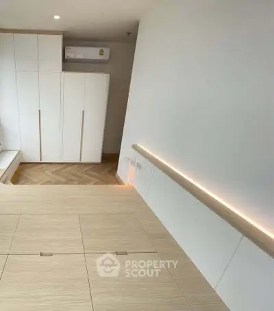 Modern minimalist bedroom with built-in storage and sleek design