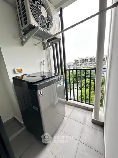 Modern balcony with washing machine and scenic view, perfect for urban living convenience.