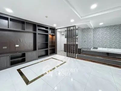Luxurious modern living room with elegant tile flooring and built-in shelving