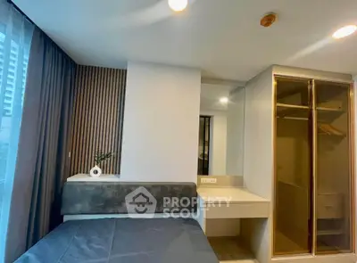 Modern bedroom with sleek design and built-in closet in urban apartment