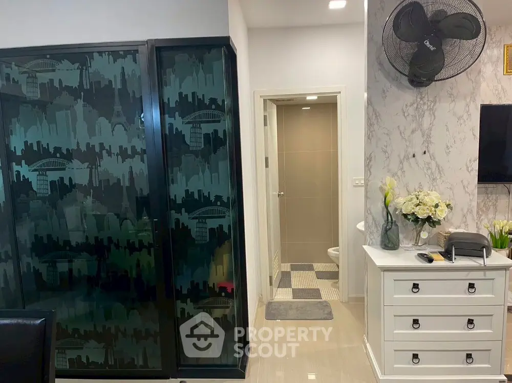 Modern bathroom with stylish decor and sleek storage solutions.