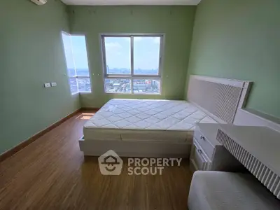 Spacious bedroom with large window offering stunning city views, featuring a comfortable bed and elegant wooden flooring.