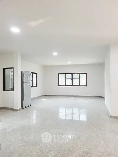 Spacious open-plan living area with modern finishes and ample natural light.