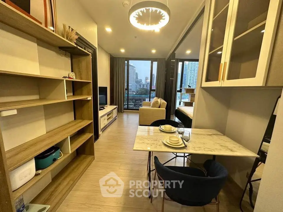 Modern open-plan living room with city view, stylish furniture, and elegant lighting.