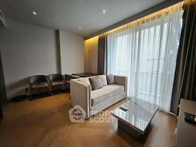 Modern living room with elegant sofa and natural light through large window