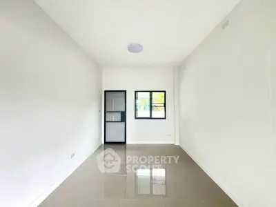 Spacious minimalist room with glossy tiled floor and large window