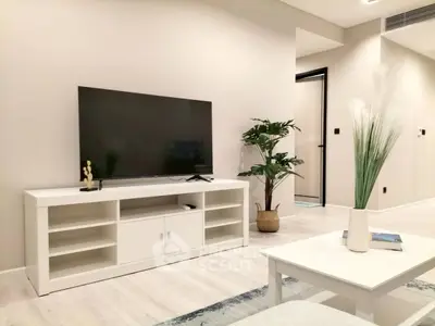 Modern living room with sleek TV setup and stylish decor