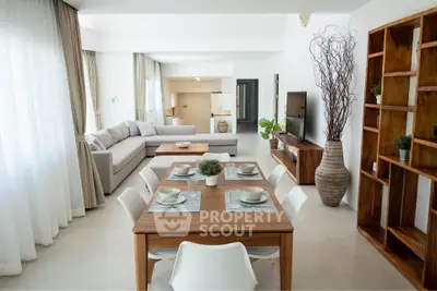Spacious modern living room with elegant dining area and stylish decor