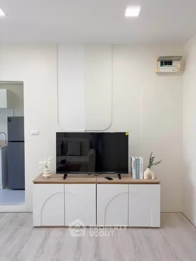 Modern living room with sleek TV stand and minimalist decor