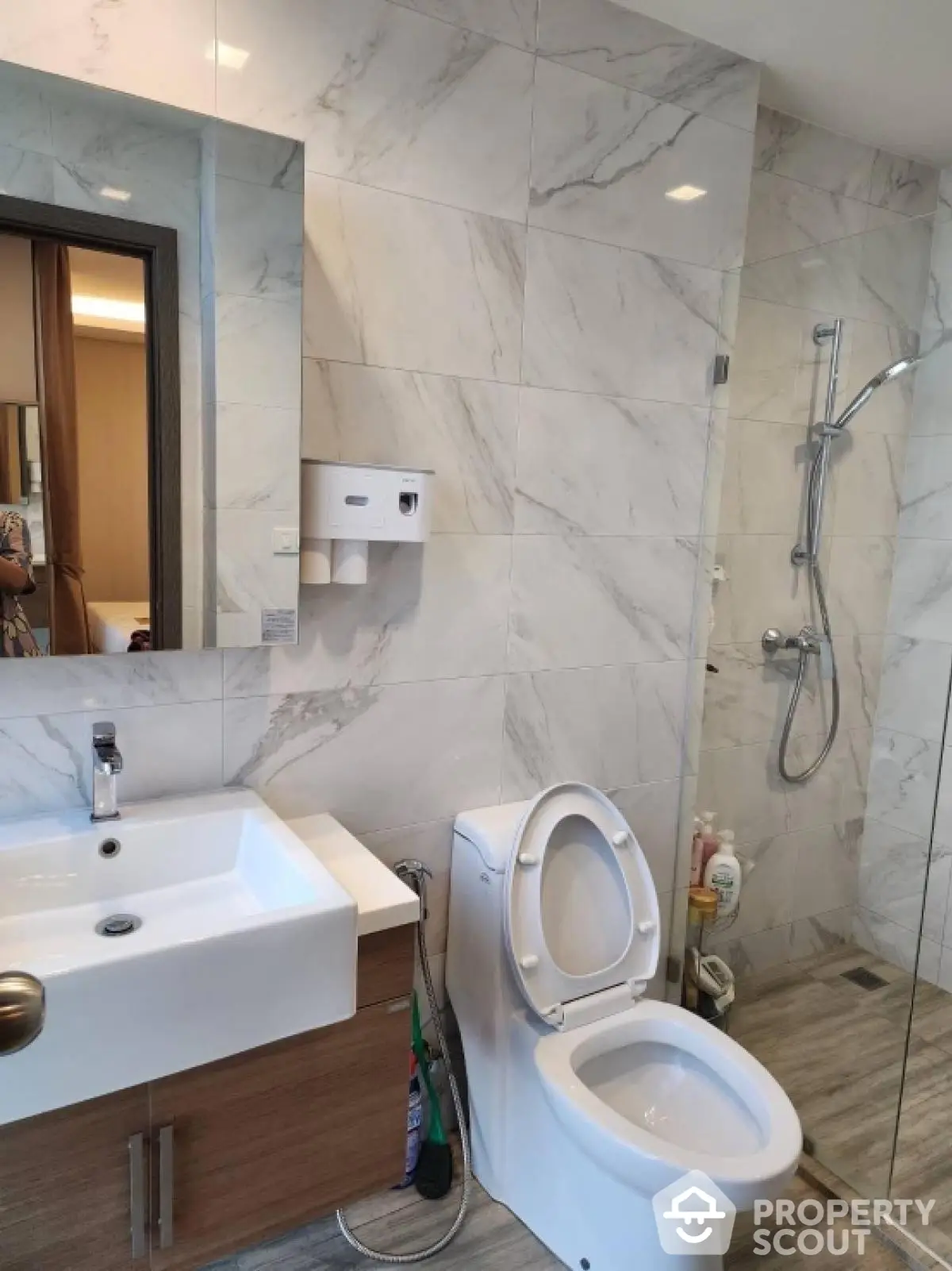 Modern bathroom with sleek fixtures and marble tiles