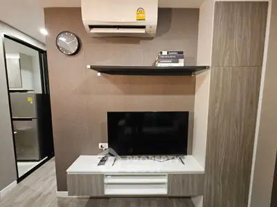 Modern living room with air conditioning and sleek TV setup