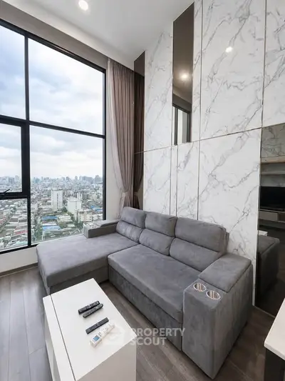 Modern living room with panoramic city view and stylish marble accent wall.