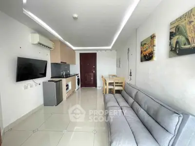 Modern living room with sleek kitchen and stylish decor