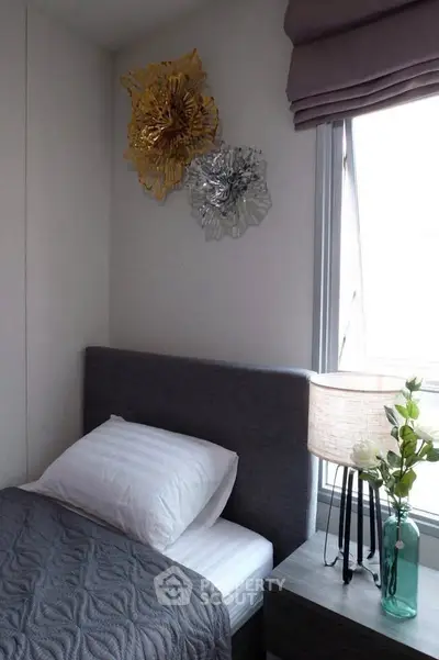 Cozy bedroom with modern decor and natural light