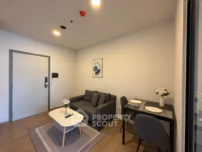 Modern living room with cozy sofa and dining area in stylish apartment